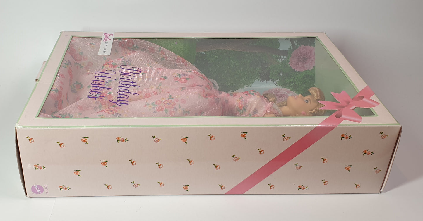 Barbie Doll in a decorative box with a pink ribbon and 'Birthday' text on a white background