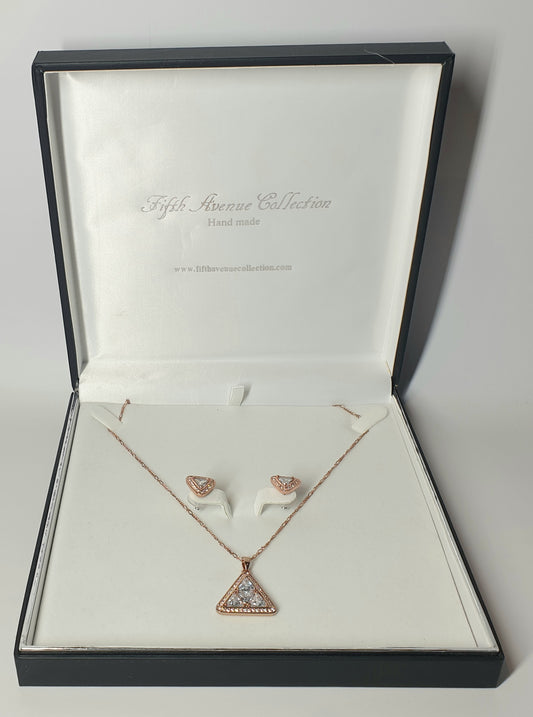 Rose gold necklace and earrings set in a Fifth Avenue Collection box.