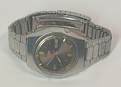 Seiko Silver wristwatch with a dark face on a light gray background