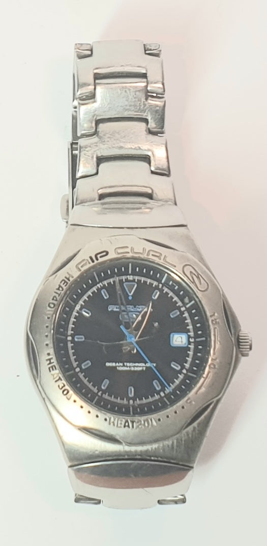 RIP CURL Silver wristwatch with a black face on a white background