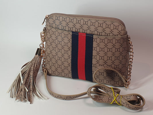 COLLETTE Patterned handbag with a strap and tassel on a light background