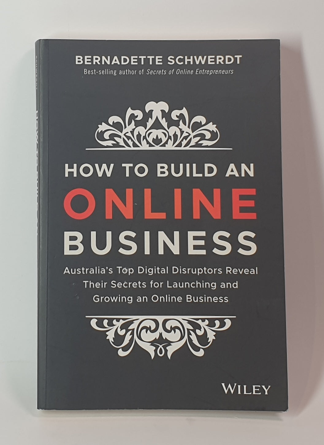 Book titled 'How to Build an Online Business' by Bernadette Schwerdt on a gray background