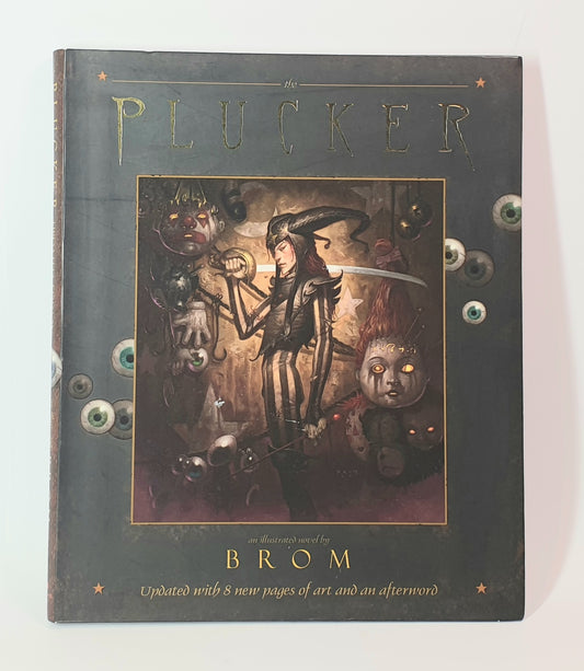 Book titled 'The Plucker' by Brom with illustrated cover on a white background