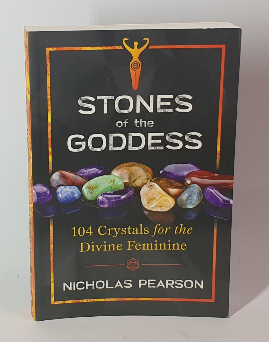 Book titled 'Stones of the Goddess' by Nicholas Pearson on a gray background