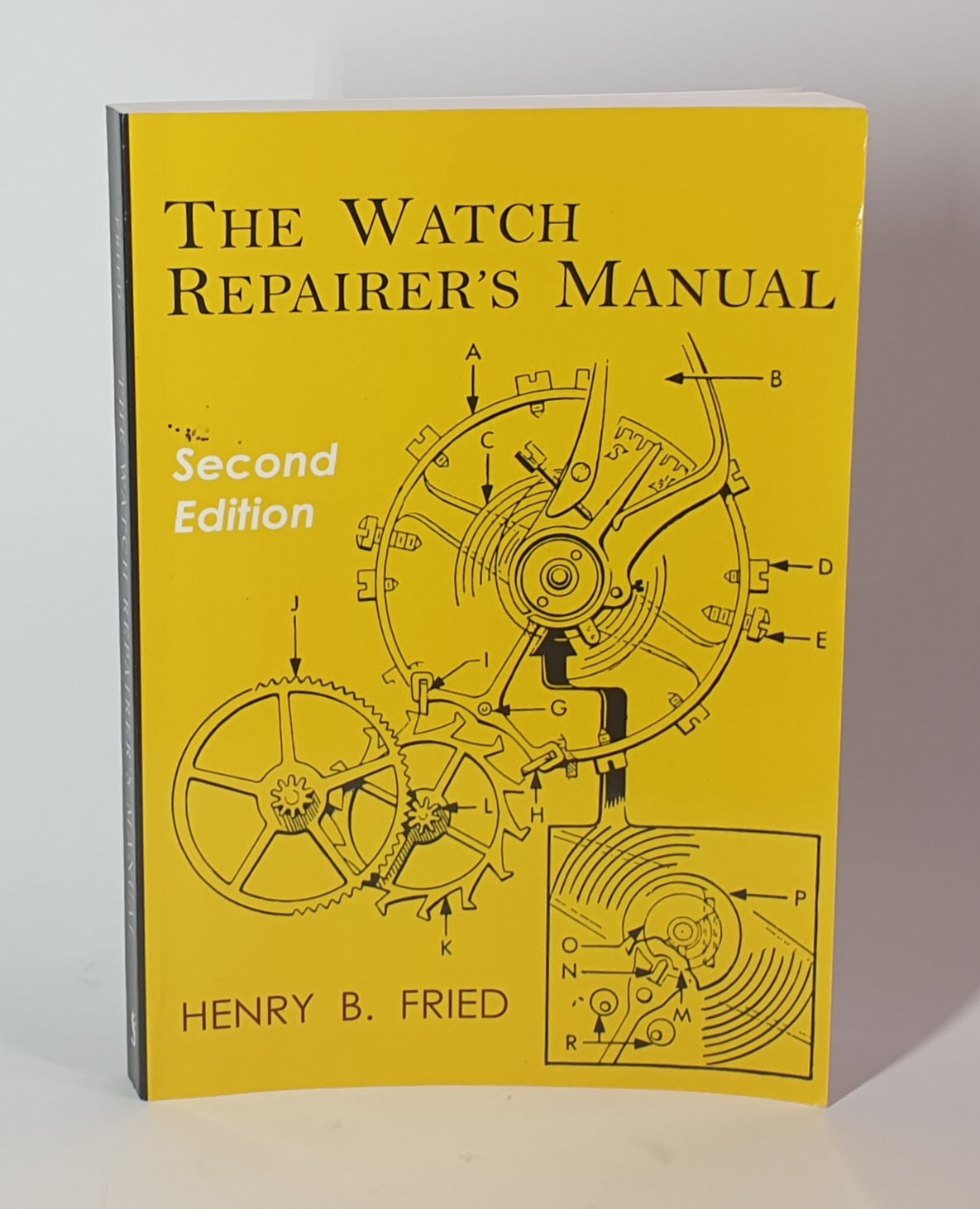 Book titled 'The Watch Repairer's Manual' by Henry B. Fried on a yellow background
