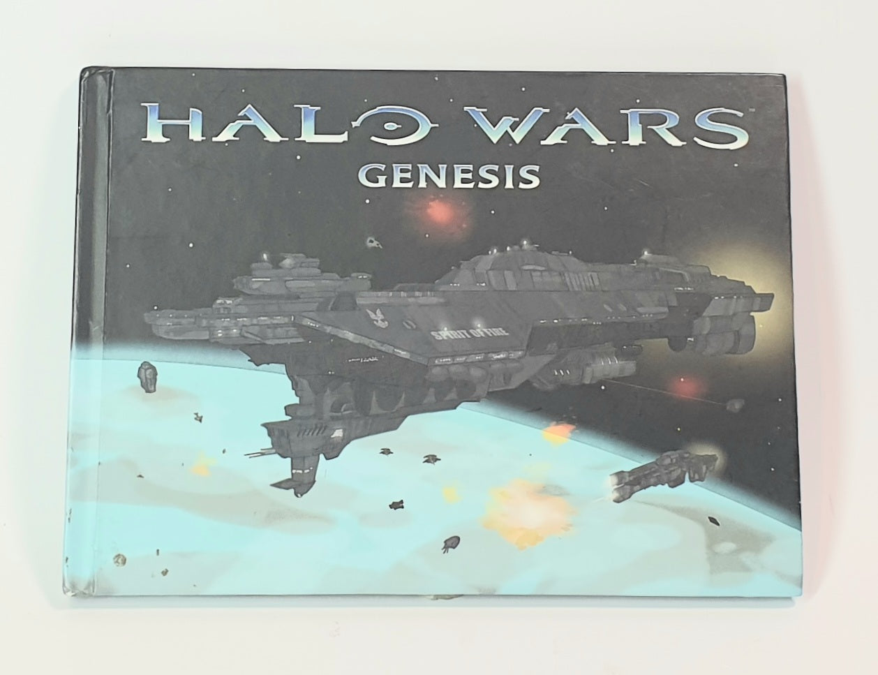 Book cover of 'Halo Wars Genesis' with a spaceship in space.