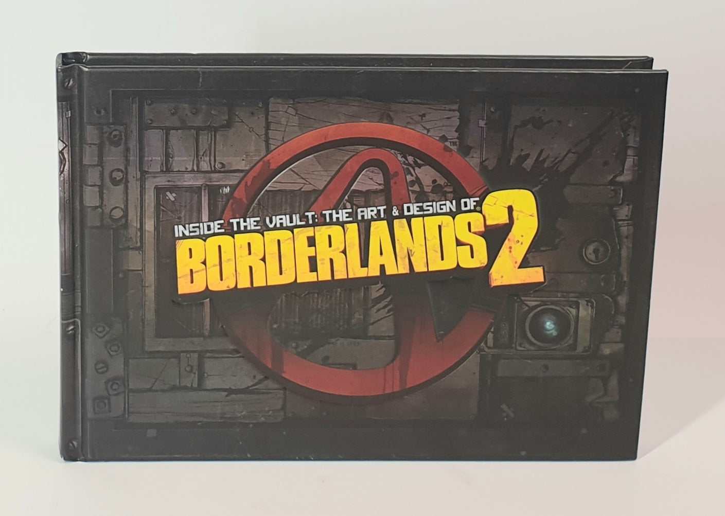 Book titled 'Inside the Vault: The Art & Design of Borderlands 2' with a metallic cover design.