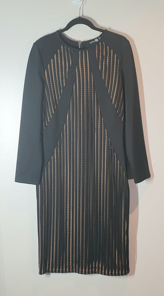 Dark gray dress with geometric pattern on a hanger against a white background