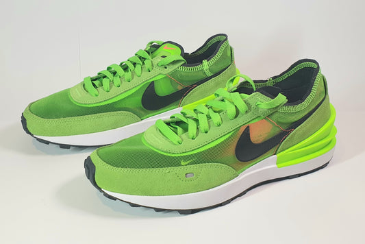 Green sneakers with a black swoosh logo on a white background