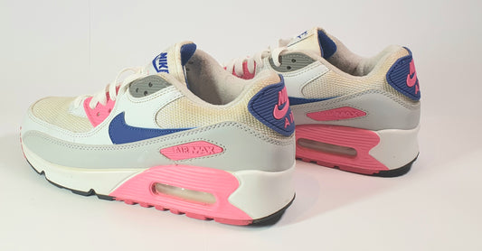 Pair of Nike Air Max sneakers with pink and blue accents on a white background