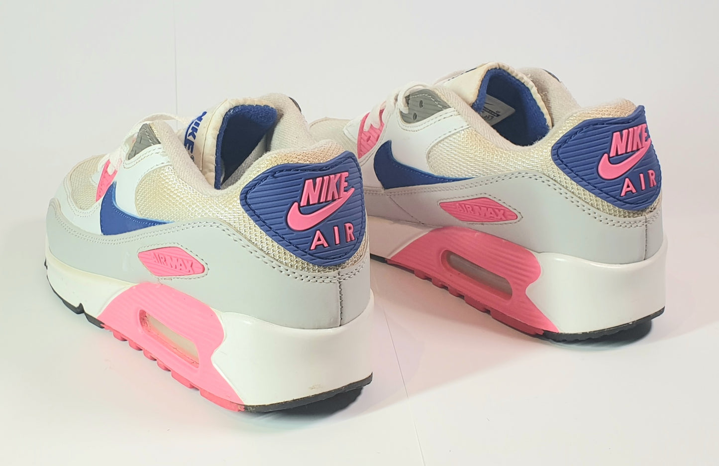 Nike Air Max 90 sneakers in a white, blue, and pink