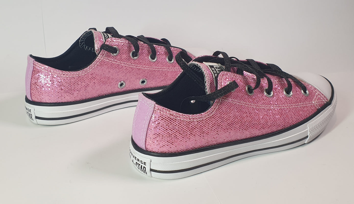 Converse Chuck Taylor All Star low-top sneakers in pink glitter with black laces. Kids