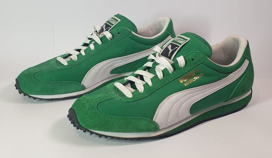 puma whirlwind Green and white sneakers with a visible brand logo on a light gray background