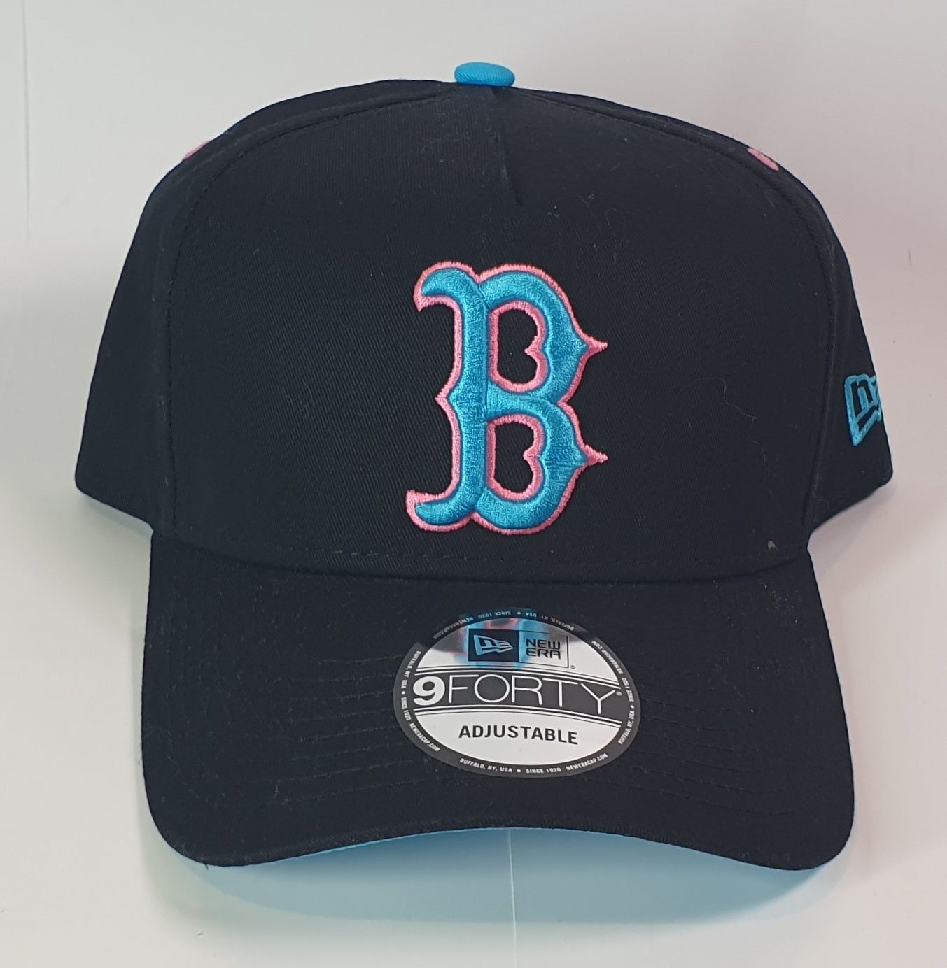 Black baseball cap with a large 'B' logo on a white background