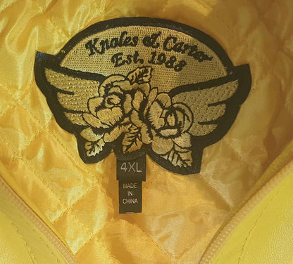Embroidered patch with floral design and text on a yellow background