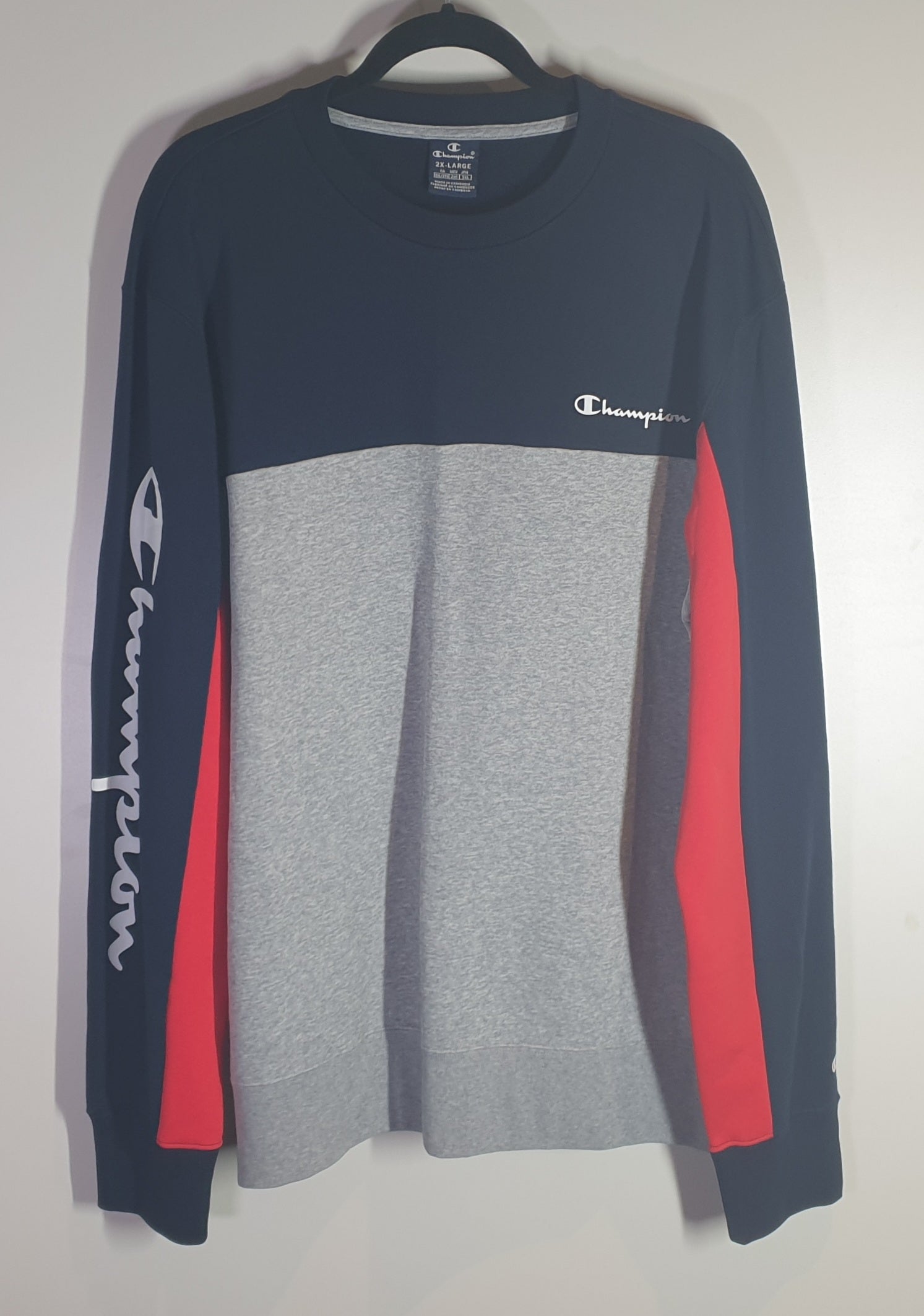 Color-blocked long-sleeve shirt with Champion logo on a white background