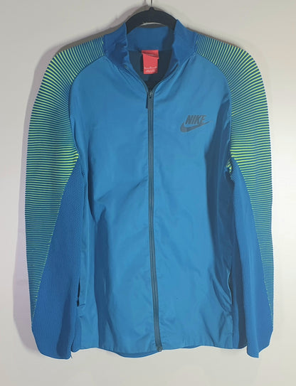 Blue Nike jacket with green accents on a hanger against a white background