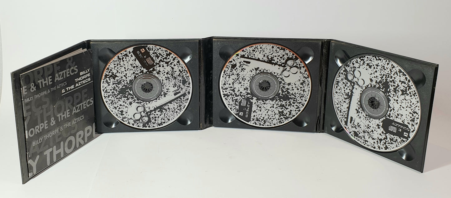 Black and white compact disc set with a branded case on a white background