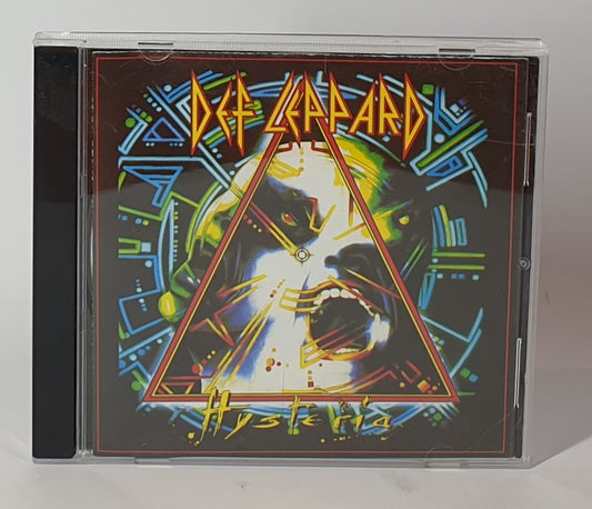 CD cover of Def Leppard's 'Hysteria' with colorful design and album title.