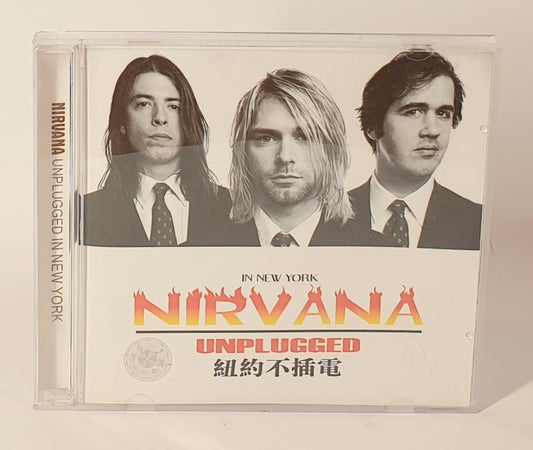 CD cover of Nirvana's 'Unplugged' with band members and text