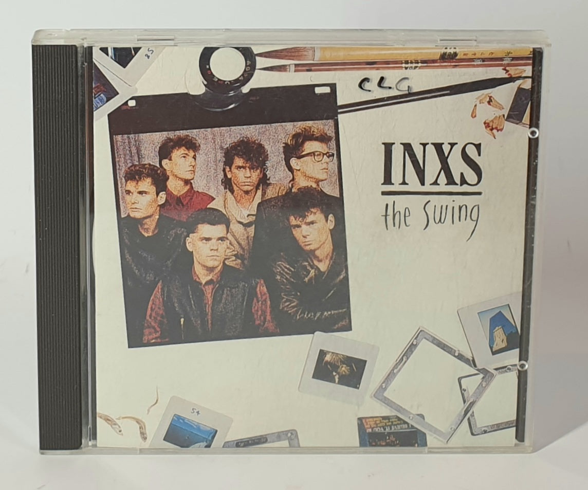 CD cover of INXS' 'The Swing' with band members and vintage design elements.
