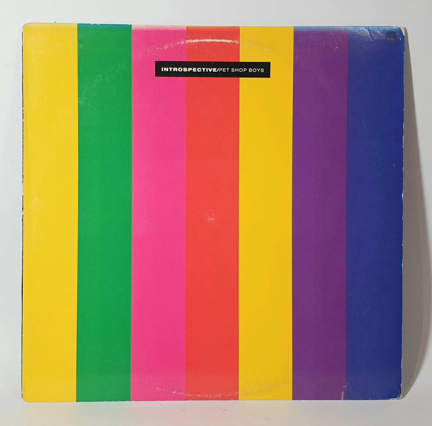 Colorful striped album cover with 'Pet Shop Boys' text