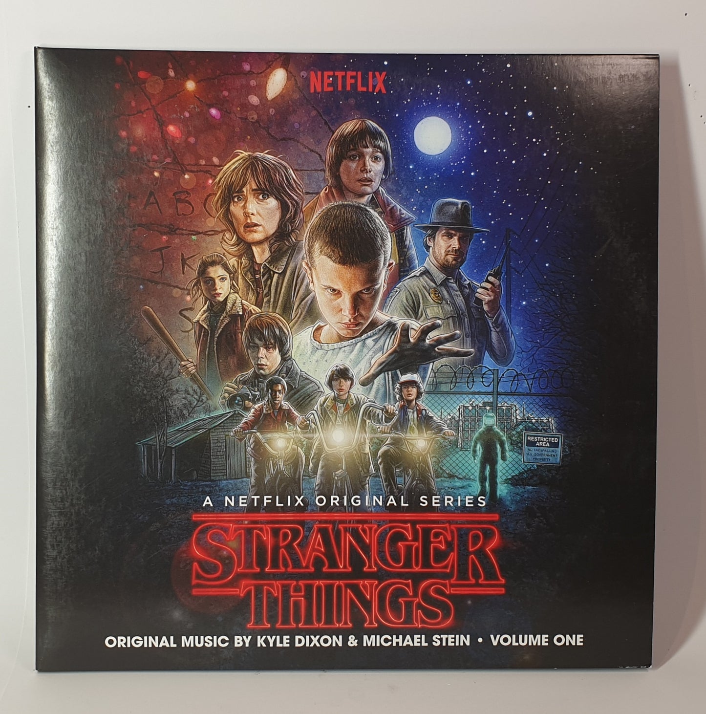 Stranger Things vinyl album with characters and Netflix logo