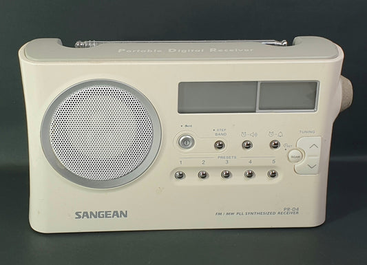 Sangean portable digital recorder on a dark background