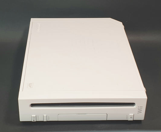 White Nintendo Wii console on a dark gray background