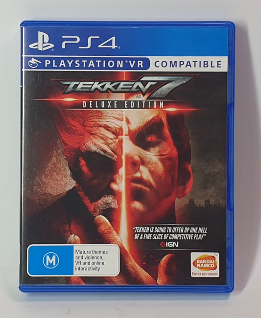 PlayStation 4 game case for 'Tekken 7 Deluxe Edition' with a character's face on the cover.