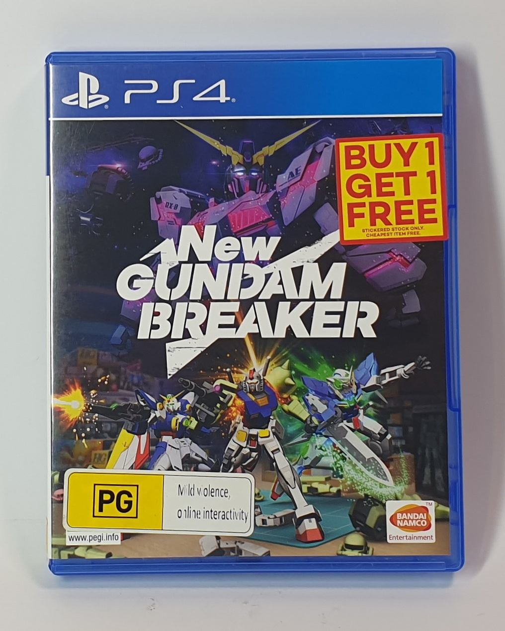 PlayStation 4 game case for 'New Gundam Breaker' with promotional text on a white background