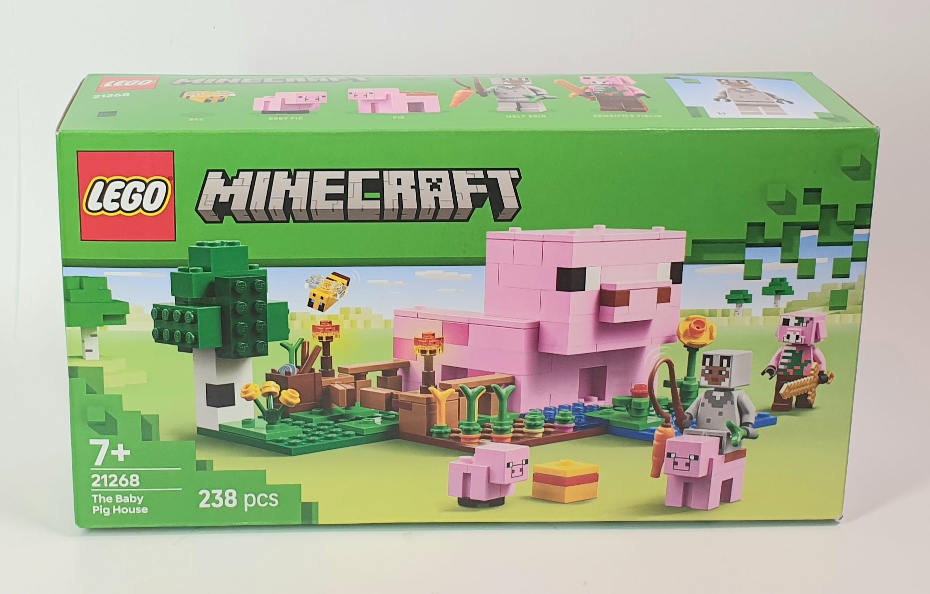 LEGO Minecraft set packaging with a pink pig figure on a green background