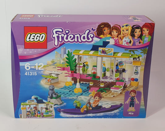 LEGO Friends packaging with characters and store design on a white background