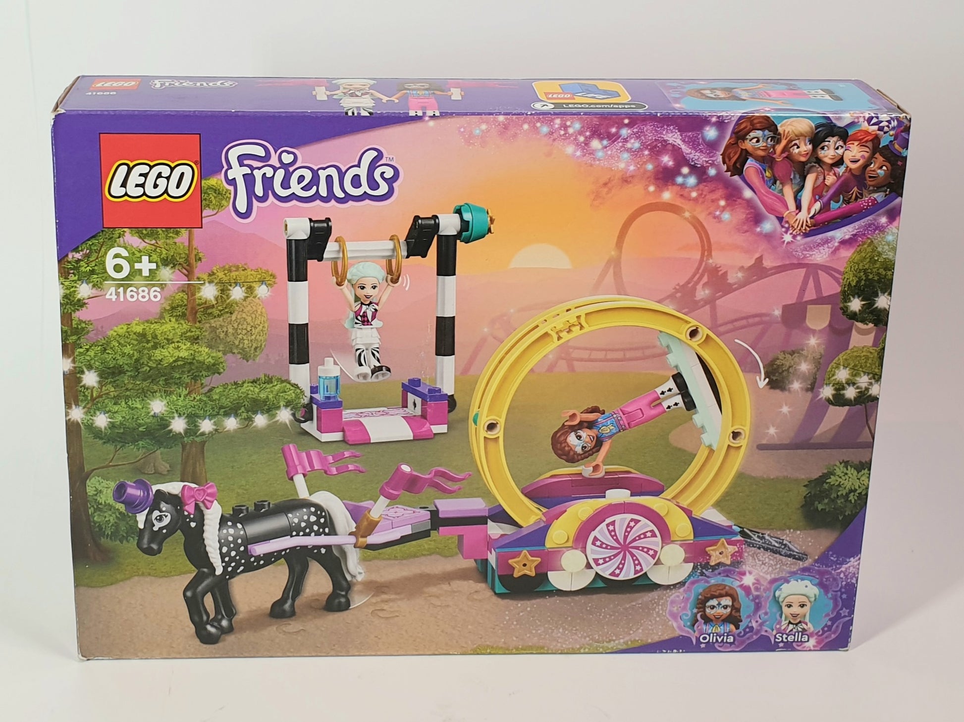 LEGO Friends toy set packaging with cartoon characters and a horse on a white background