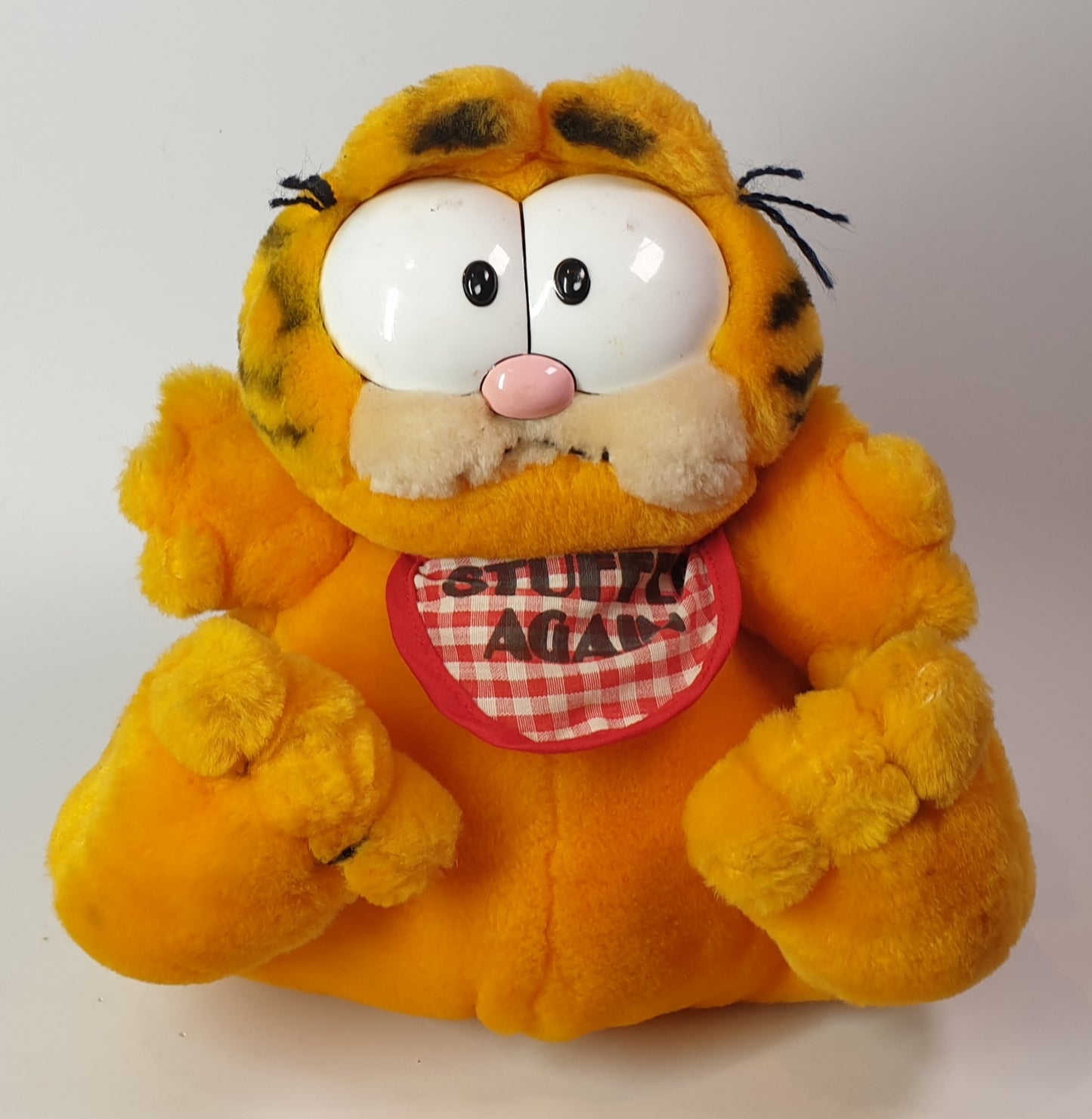 Garfield Plush toy the cartoon character with a checkered bib on a white background